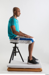 Whole Body Man Black Sports Shirt Shorts Slim Sitting Studio photo references